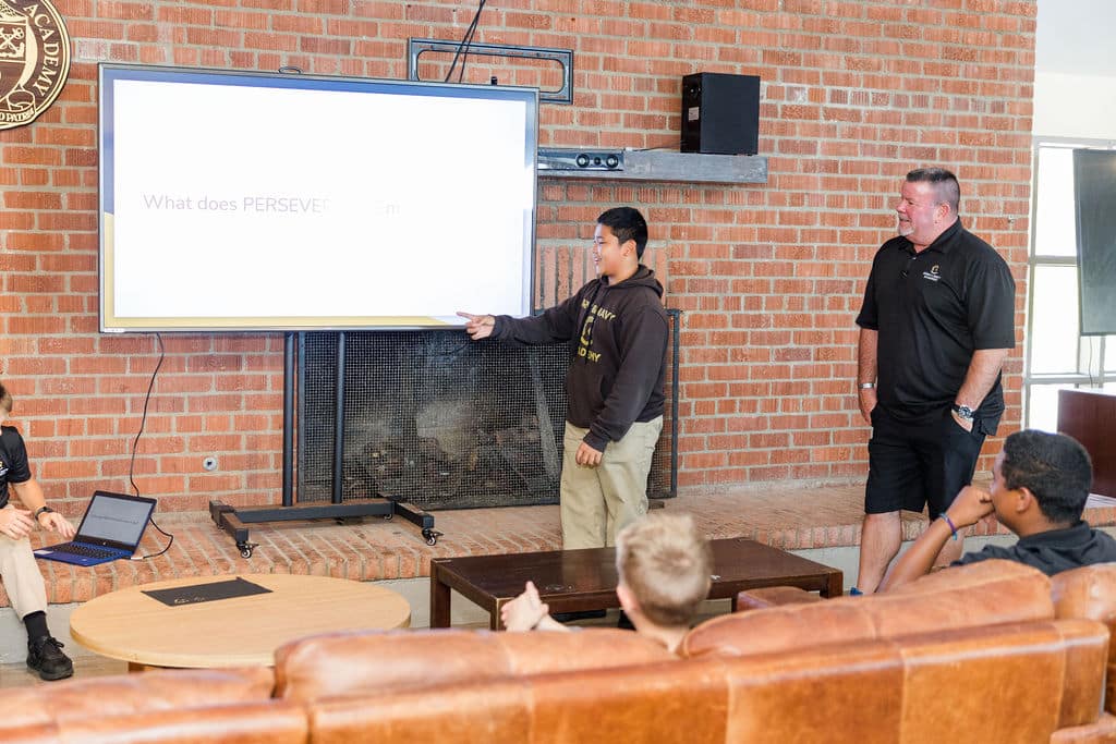 young student leads a discussion